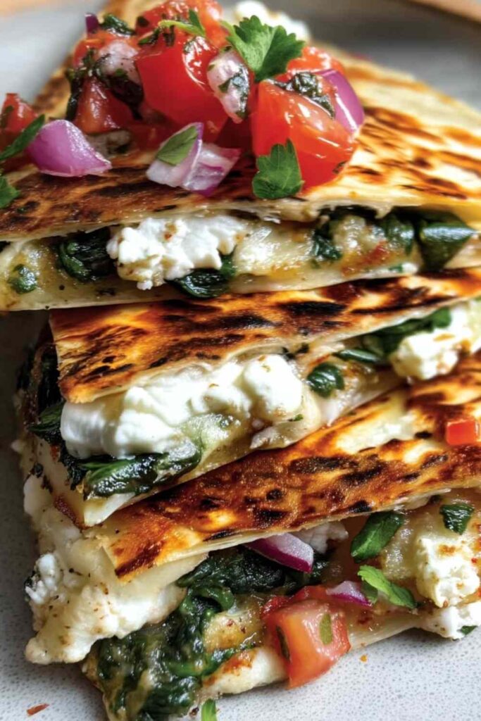 Mediterranean Quesadillas with Spinach, Feta, and Mozzarella 6 Mediterranean quesadillas with spinach, feta, and mozzarella served with tzatziki