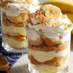 Protein banana pudding layered in clear glass with vanilla wafers and fresh banana slices