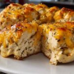 Easy ranch chicken bake with melted cheddar cheese fresh from the oven in a white baking dish