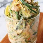 Creamy Asian cucumber salad bowl with sesame-ginger dressing, edamame, and sesame seeds