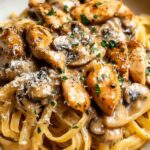 Creamy Chicken Marsala Pasta with mushrooms and Parmesan in a large skillet
