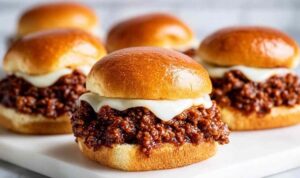 French Onion Beef Sloppy Joes with caramelized onions and melted Provolone on a toasted brioche bun