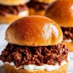 French Onion Beef Sloppy Joes with caramelized onions and melted Provolone on a toasted brioche bun