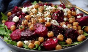 Chickpea Beet and Feta Salad Chickpea beet and feta salad in a large white bowl with fresh mint and parsley