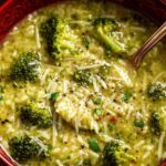 Bowl of creamy garlic Italian broccoli soup topped with Parmesan and fresh basil