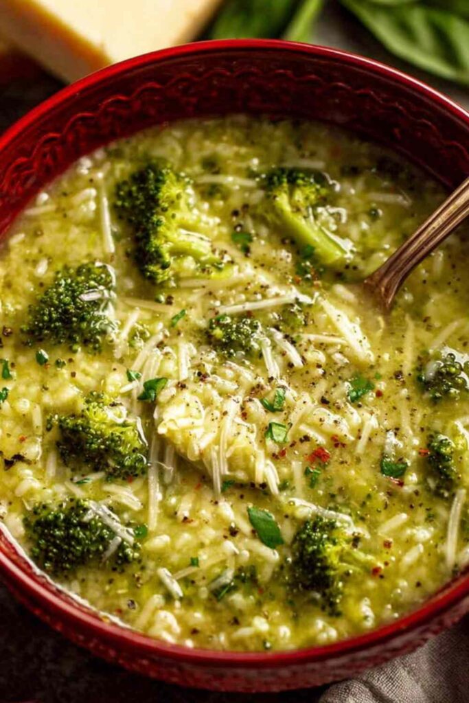 Bowl of creamy garlic Italian broccoli soup topped with Parmesan and fresh basil