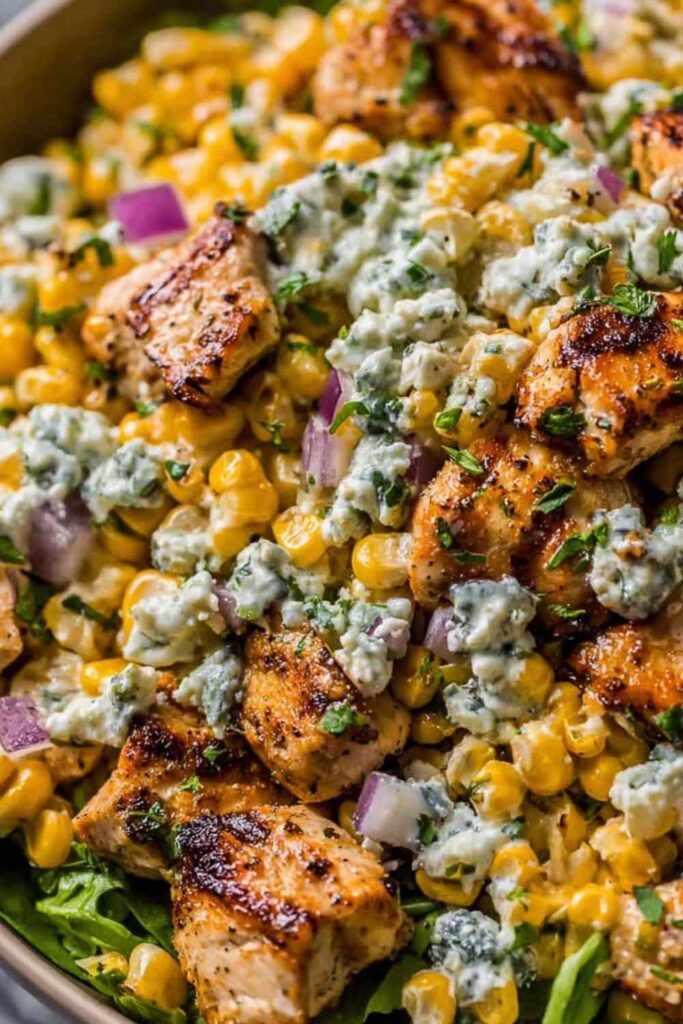 High Protein Chicken Street Corn Salad - Fresh, Creamy, and Low Calorie! 6 High protein chicken street corn salad with grilled chicken, charred corn, avocado, and creamy lime dressing in a large bowl