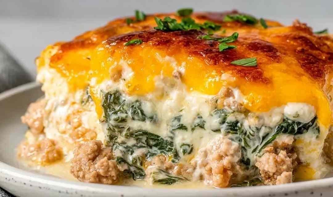 High protein ground turkey casserole fresh out of the oven in a baking dish with golden melted cheese on top