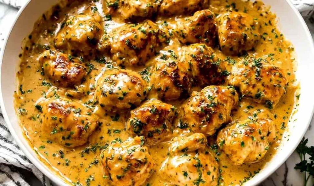 Texas Roadhouse Butter Chicken Skillet 5 Texas Roadhouse Butter Chicken Skillet with creamy butter sauce and fresh parsley in a large skillet