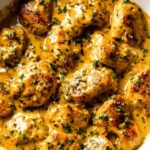 Texas Roadhouse Butter Chicken Skillet with creamy butter sauce and fresh parsley in a large skillet