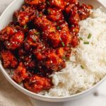 Crispy air fryer General Tso's chicken tossed in homemade sweet and spicy sauce served over steamed white rice