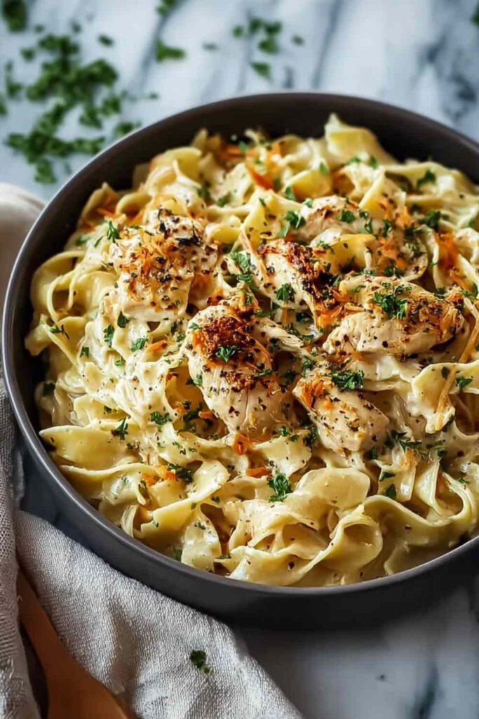 Chicken Buttered Noodles 6 Chicken buttered noodles in a large skillet topped with fresh parsley and grated parmesan