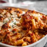 Chicken Parmesan Baked Ziti in a 9x13 baking dish with golden melted mozzarella and crispy breaded chicken