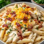 Crack chicken penne in a large skillet with creamy ranch cheese sauce, crispy bacon crumbles, and fresh chives