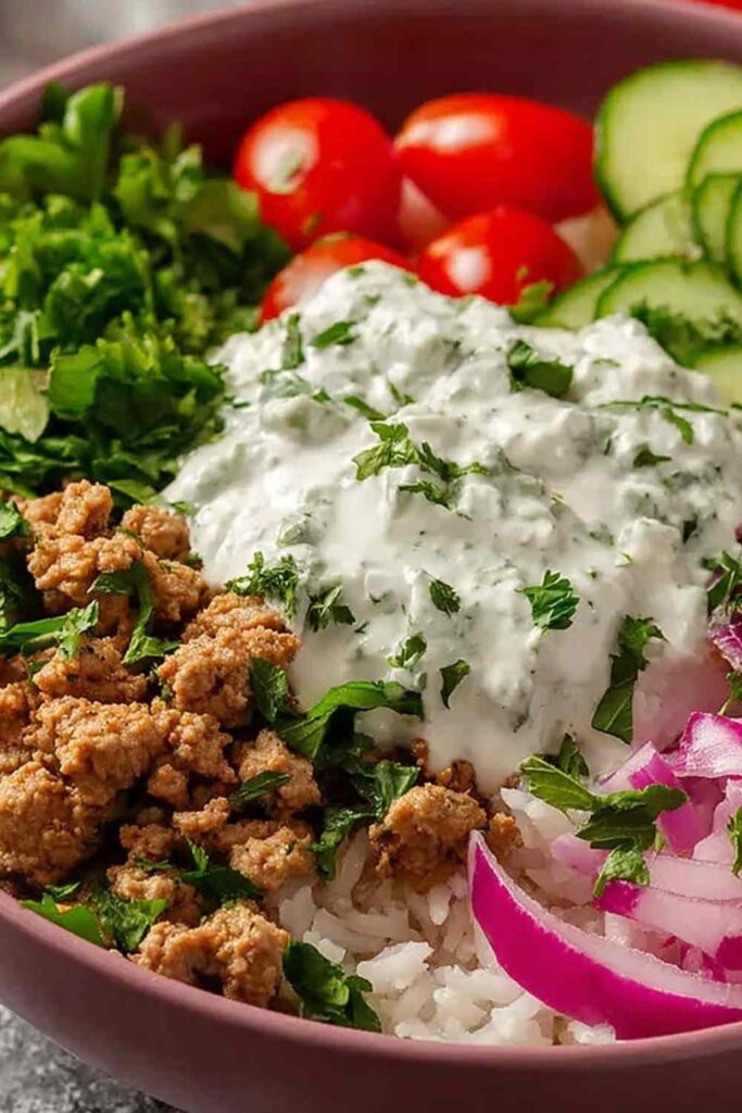Healthy ground turkey bowls with rice, black beans, avocado, and fresh cilantro