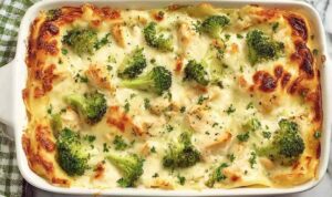 Healthy Chicken and Broccoli Lasagna Healthy chicken and broccoli lasagna slice on a white plate with golden melted mozzarella