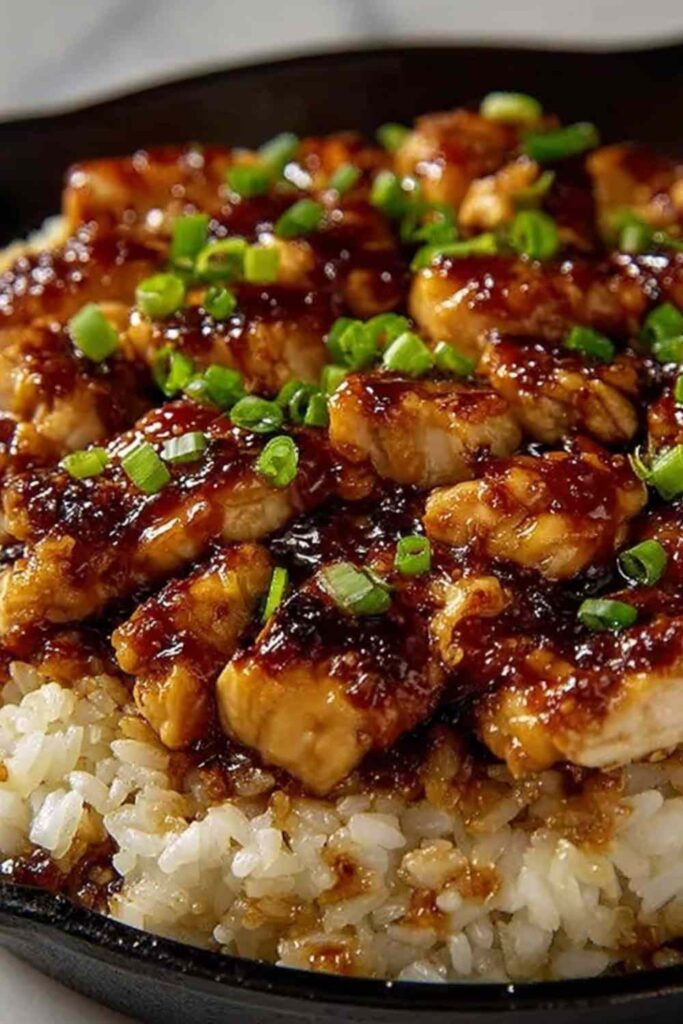 Honey BBQ Chicken Rice 6 Honey BBQ chicken rice recipe in a skillet garnished with fresh green onions