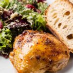 Juicy maple bourbon chicken breasts with a sticky caramelized glaze on a white plate