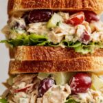 Napa almond chicken salad Panera copycat served on toasted sourdough with fresh lettuce and Roma tomato slices