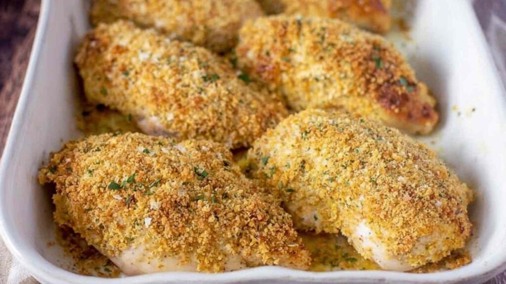 Crispy Parmesan Ranch Chicken breast baked golden in a baking dish