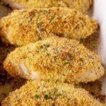 Crispy Parmesan Ranch Chicken breast baked golden in a baking dish
