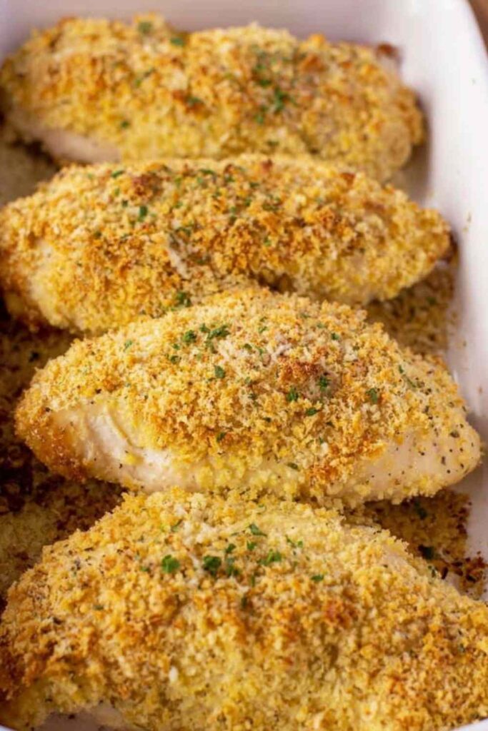 Crispy Parmesan Ranch Chicken breast baked golden in a baking dish