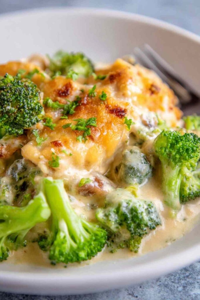Chicken divan casserole baked golden and bubbly in a white square baking dish