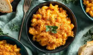Chicken Mac and Cheese Casserole Chicken mac and cheese casserole in a 9x13 baking dish with golden Panko topping and melted cheddar cheese