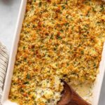 Chicken and stuffing casserole in a white baking dish with golden crispy stuffing topping fresh from the oven