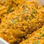 Crispy Cool Ranch Dorito Chicken baked golden in a baking dish with a crunchy Dorito crust